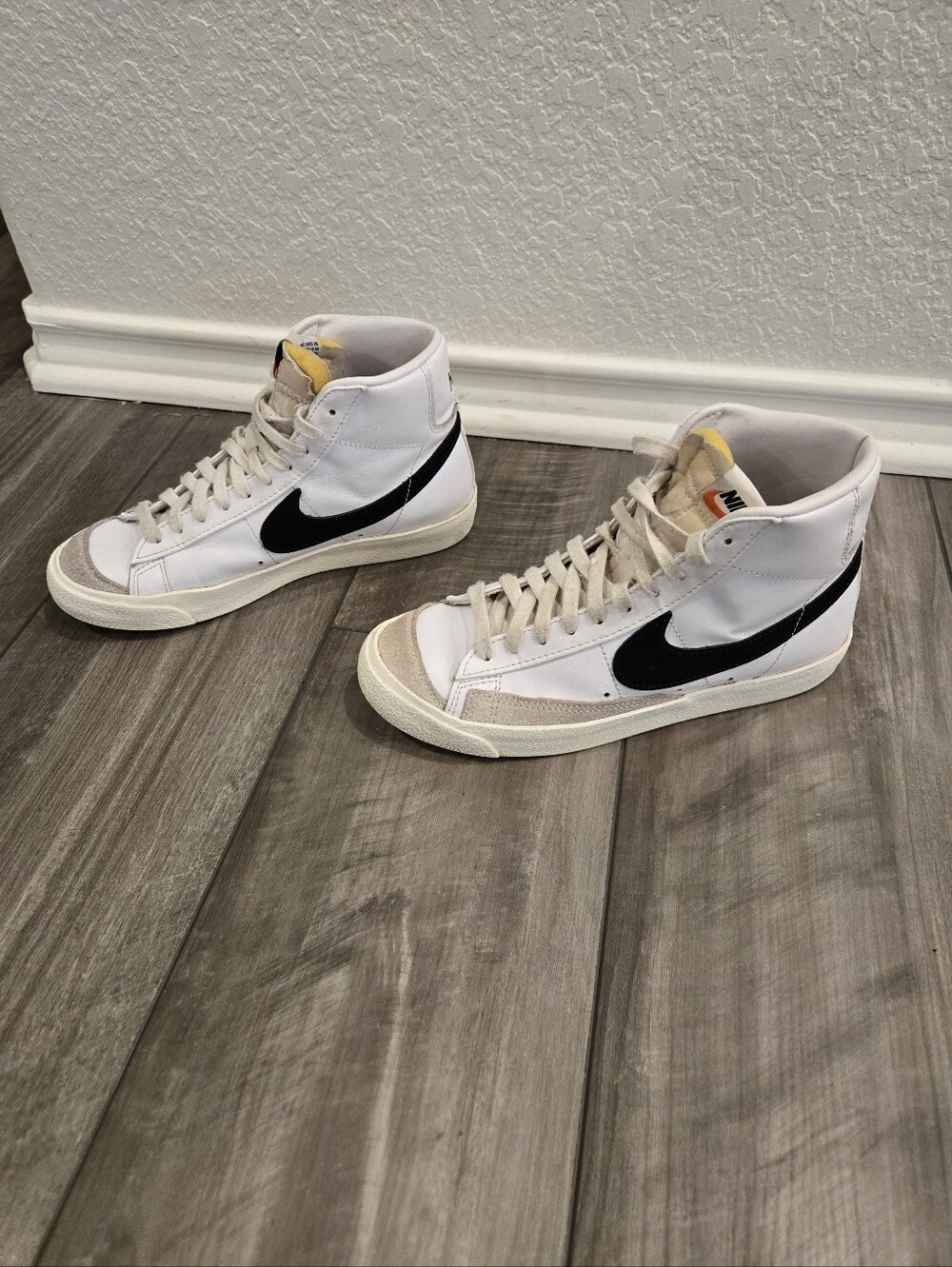 Nike Blazer Mid '77 women's sneakers, size 8. White leather with black Swoosh.